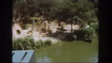 Disneyland California (1962): Native Huts Along The Water Are Viewed From A Boat