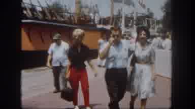 Disneyland California (1962): People Walk Past A Sailing Vessel Tied To A Dock