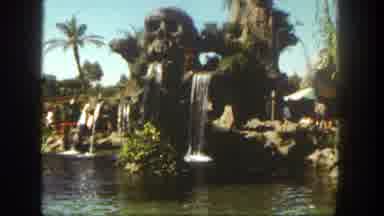 Disneyland California (1962): A Large Skull Fountain At An Amusement Part Followed