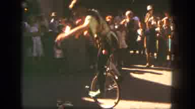 Disneyland California (1962): Man In A Costume Rides A Unicycle Around For The
