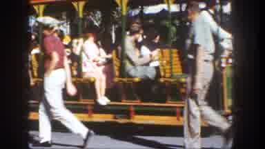 Disneyland California (1962): People Ride The Trolley And Pass Several Others