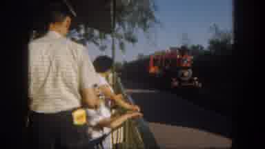 Disneyland California (1962): A Group Of People Greets People On The Train That Is