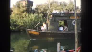 Disneyland California (1962): A Touring Tug Boat Filled With Eager People Floats