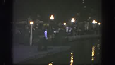 Disneyland California (1962): A Riverside Walkway Is Crowded With People A Man