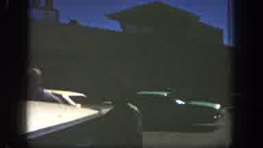 San Diego California (1962): Man Driving Car Down A Street