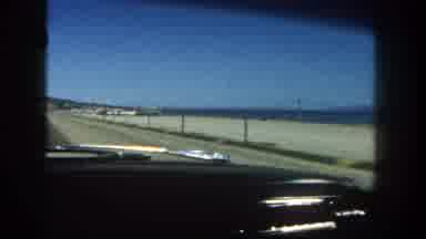San Diego California (1962): Inside Of Car As It Drives Down A Road By The Beach