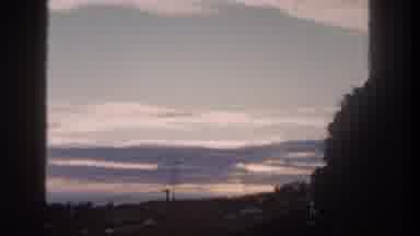San Diego California (1962): Sun Captured Rising Behind The Clouds In The Sky