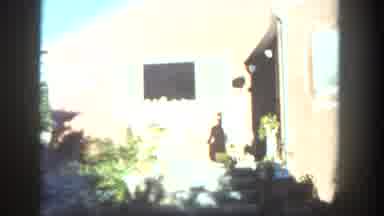 San Diego California (1962): Woman Doing A Barbecue In The Yard And Then Going