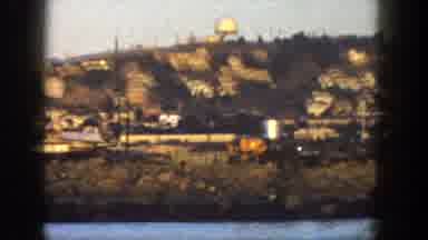SAN DIEGO CALIFORNIA-1962: Coastal Town With Dome Structure And Boats At Sunset
