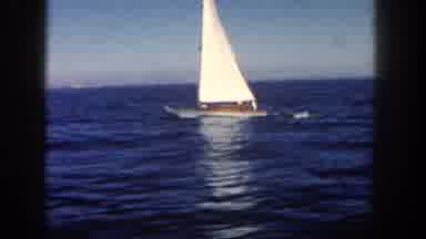 San Diego California (1962): Boat Sailing Out At Sea While Towing A Small Dingy In