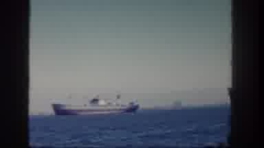 San Diego California (1962): A Boat Sails On The Water With A City Of Industry In