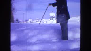 Proctor Minnesota (1963): Man With Coat And Hat Measuring The Thickness Of The