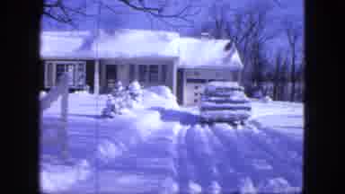 Proctor Minnesota (1963): Thick Wintery Snow Covers Entire Driveway The Car Is