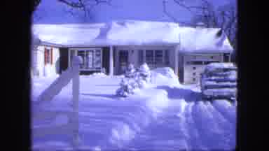 Proctor Minnesota (1963): Snow Covered Town With Red Building And A House Showing