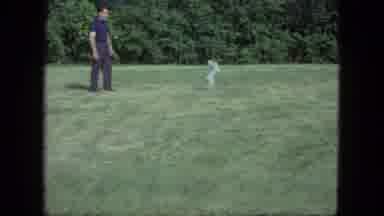 Saint Paul Minnesota (1963): Man Playing Catch With Small White Dog
