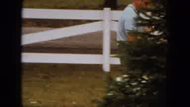 Saint Paul Minnesota (1963): Man Carries Puppy While Sitting On A Ride On