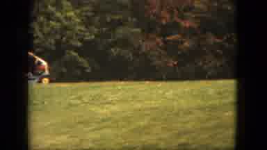 Saint Paul Minnesota (1963): Man On Riding Mower Mowing Lawn