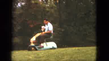 Saint Paul Minnesota (1963): Man Mowing Lawn With Pet