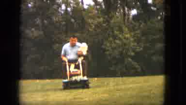 Saint Paul Minnesota (1963): Man Mowing Lawn On Ride On Mower With Dog In Lap
