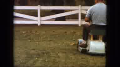 Saint Paul Minnesota (1963): Man On A Ride On Mower Does Laps Around The Yard