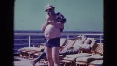 San Diego California (1963): Man Takes Photos While Being Filmed On A Cruise Ship