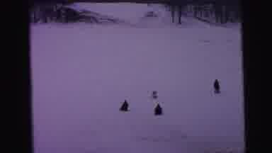 Camden New Jersey (1964): Person Wearing Red Hat Sleds Downhill With Others On A