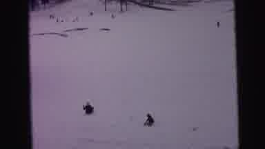 Camden New Jersey (1964): Woman Enjoys Sledding Downhill