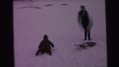 Camden New Jersey (1964): Woman Wearing Green Scarf Sleds Downhill With Child