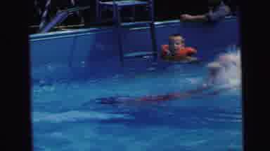 Camden New Jersey (1964): Young Girl Swims Underwater Across Backyard Pool While