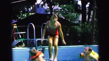 Camden New Jersey (1964): Girl Wearing Red Swimwear Jumps In Blue Pool On A Sunny
