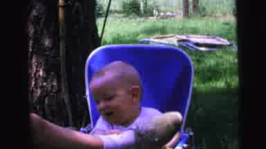 Camden New Jersey (1964): Happy Baby Sitting In An Infant Seat Grabbing At Mom Or