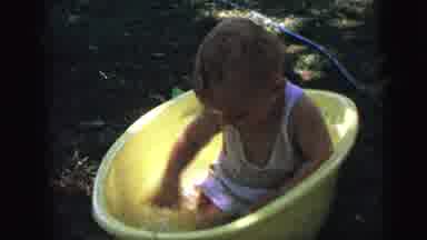 Camden New Jersey (1964): A Child Sitting In The Water Tub And Playing Happily