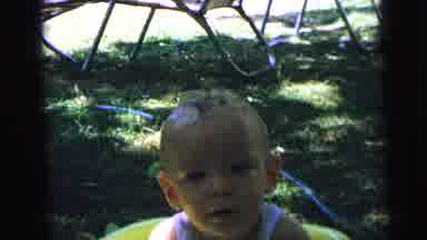 Camden New Jersey (1964): Two Babies Sit In Green Playpen Tugging On Blue Toy