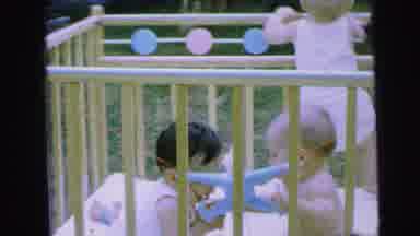 Camden New Jersey (1964): Three Babies Play In Wooden Playpen On A Clear Day