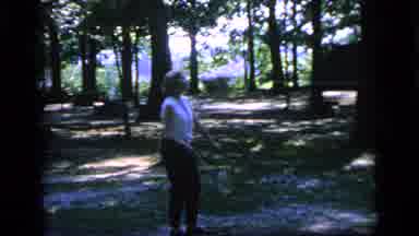 Camden New Jersey (1964): A Aged Lady Is Playing Shuttle In The Garden With