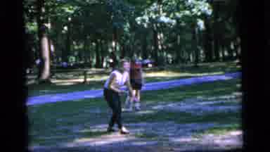 Camden New Jersey (1964): A Woman Picks Up A Badminton Shuttlecock Followed By Men