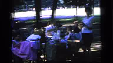 Camden New Jersey (1964): People Picnic In A Park Under The Shade Of Trees Near A