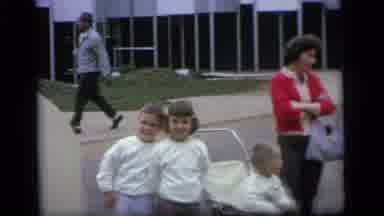 Camden New Jersey (1964): A Child Is Playing In The Garden With Parents On The