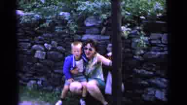 Camden New Jersey (1964): A Mom And Son Squatting By A Tree Waving To The Camera
