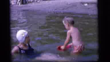 Camden New Jersey (1964): A Woman Is Sitting In The Water And The Girl's Child