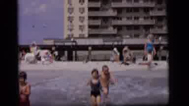 Camden New Jersey (1964): Three Excited Kids Playing And Jumping In The Waves Of