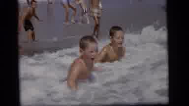 Camden New Jersey (1964): Young Boys Playing In Ocean Waves