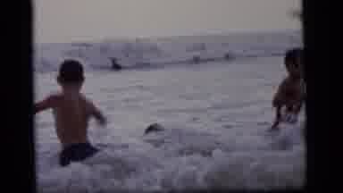 Camden New Jersey (1964): Several Kids Playing And Jumping In The Waves Of The