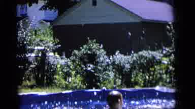 Camden New Jersey (1964): Young Boy Splashing In A Above Ground Pool In Slow