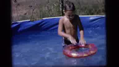 Camden New Jersey (1964): Child Plays With Floating Toy In Backyard Pool