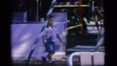 Camden New Jersey (1964): Boy Wearing Blue Shorts Climbs On Backyard Swing On A