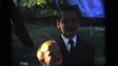Camden New Jersey (1964): Boy Wearing White Shirt Holds Small Brown Object Against