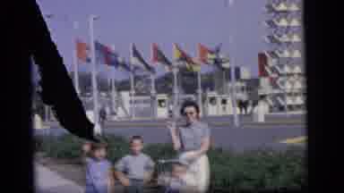 Camden New Jersey (1964): Family Of Mother And Children Outside Of Park Waving In