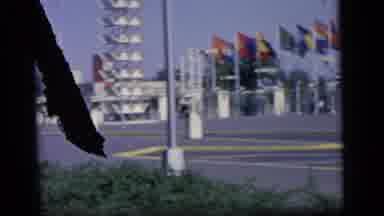 Camden New Jersey (1964): A Man And Children Stand In Front Of A Row Of Flags And