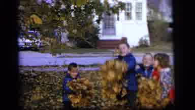 Camden New Jersey US (1964): Kids Are Throwing Piles Of Leaves Up In The Air